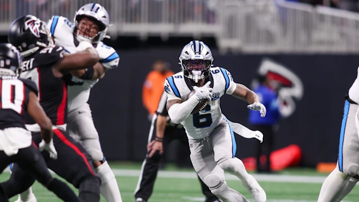 Carolina Panthers running back Miles Sanders runs the ball against the Atlanta Falcons in the third quarter at Mercedes-Benz Stadium.