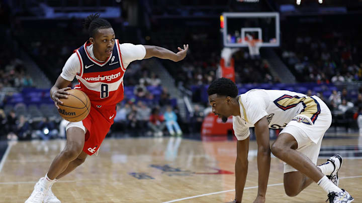 Jan 5, 2025; Washington, District of Columbia, USA; Washington Wizards guard Bub Carrington (8) drives to the basket as New Orleans Pelicans forward Herbert Jones (2) defends in the second quarter at Capital One Arena. Mandatory Credit: Geoff Burke-Imagn Images