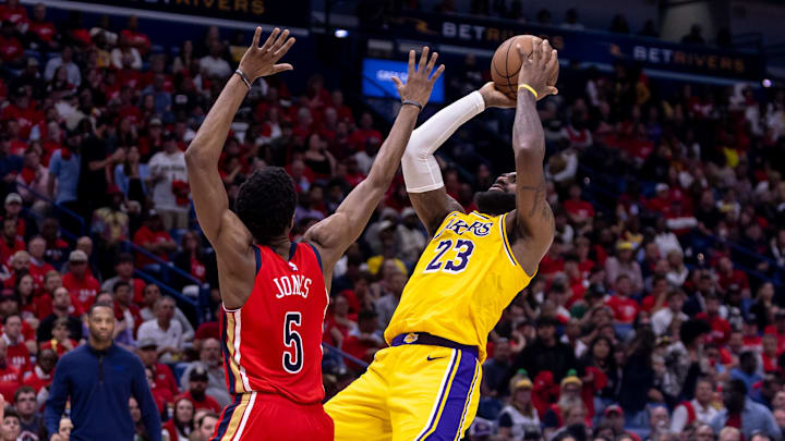 Apr 16, 2024; New Orleans, Louisiana, USA; Los Angeles Lakers forward LeBron James (23) shoots against New Orleans Pelicans forward Herbert Jones (5) during the second half of a play-in game of the 2024 NBA playoffs at Smoothie King Center. Mandatory Credit: Stephen Lew-Imagn Images