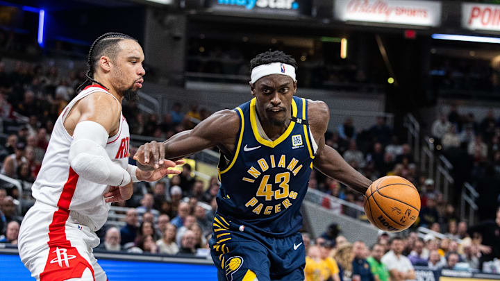 Feb 6, 2024; Indianapolis, Indiana, USA;  Indiana Pacers forward Pascal Siakam (43) dribbles the ball while Houston Rockets forward Dillon Brooks (9) defends in the second half at Gainbridge Fieldhouse. Mandatory Credit: Trevor Ruszkowski-Imagn Images