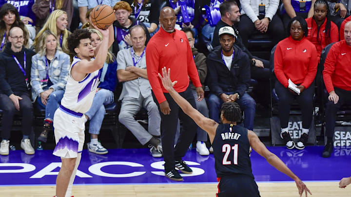 Oct 16, 2025; Salt Lake City, Utah, USA; Utah Jazz guard Walter Clayton Jr. (13) takes a three point shot over Portland Trail Blazers guard/forward Rayan Rupert (21) during the second half at Delta Center. Mandatory Credit: Peter Creveling-Imagn Images