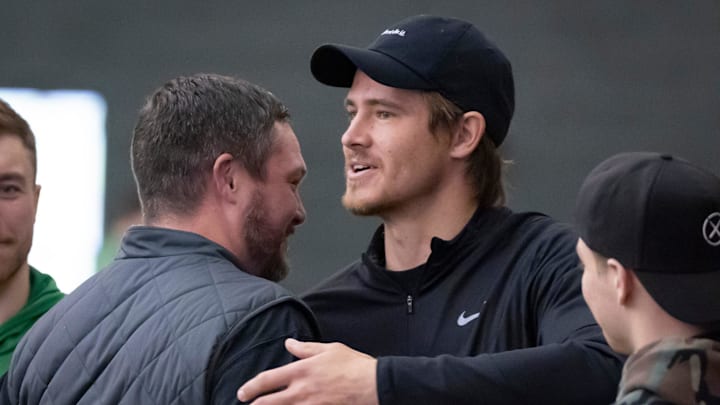 Oregon head coach Dan Lanning, left, hugs Los Angeles Chargers quarterback and former Oregon quarterback Justin Herbert during the Oregon football’s Pro Day Tuesday, March 18, 2025, at the Moshofsky Center in Eugene, Ore.