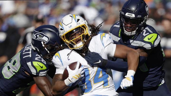 Oct 4, 2026; Seattle, Washington, USA; Seattle Seahawks cornerbacks Nehemiah Pritchett (28) and Devon Witherspoon (21) tackle Los Angeles Chargers running back Keaton Mitchell (34) during the first half at Lumen Field. Mandatory Credit: Joe Nicholson-Imagn Images Oct 4, 2026; Seattle, Washington, USA; Seattle Seahawks cornerbacks Nehemiah Pritchett (28) and Devon Witherspoon (21) tackle Los Angeles Chargers running back Keaton Mitchell (34) during the first half at Lumen Field. Mandatory Credit: Joe Nicholson-Imagn Images