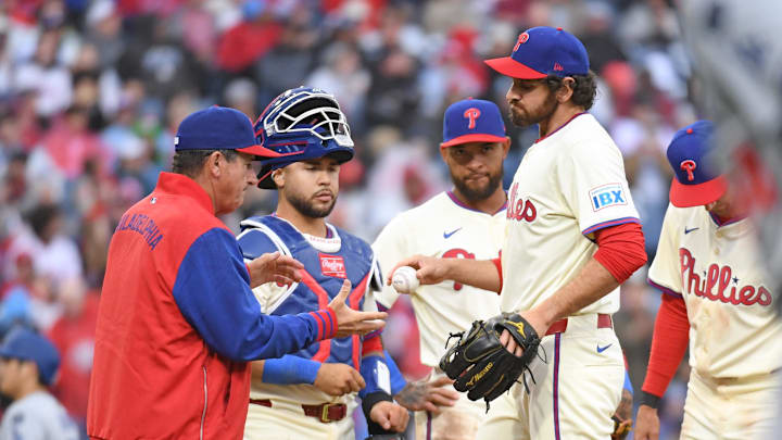 Apr 6, 2025; Philadelphia, Pennsylvania, USA; Philadelphia Phillies pitcher Jordan Romano (68) hands the ball to  manager Rob Thomson (59) after being removed from the game during the seventh inning against the Los Angeles Dodgers at Citizens Bank Park. Mandatory Credit: Eric Hartline-Imagn Images