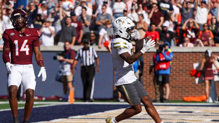 Oct 11, 2025; Atlanta, Georgia, USA; Georgia Tech Yellow Jackets wide receiver Malik Rutherford (8) scores a touchdown against the Virginia Tech Hokies in the first quarter at Bobby Dodd Stadium at Hyundai Field. Mandatory Credit: Brett Davis-Imagn Images