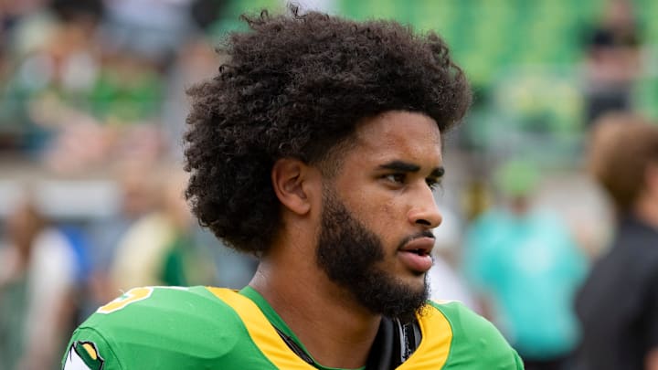 Oregon Quarterback Dante Moore Iowa hawkeyes ducks big ten playoff heisman classy pray teammate leader dan lanning injury