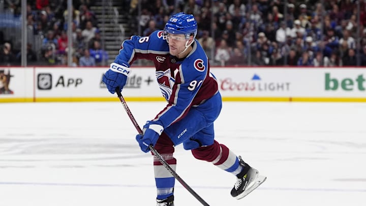 Jan 14, 2025; Denver, Colorado, USA; Colorado Avalanche right wing Mikko Rantanen (96) shoots the puck in the second period against the New York Rangers at Ball Arena. Mandatory Credit: Ron Chenoy-Imagn Images