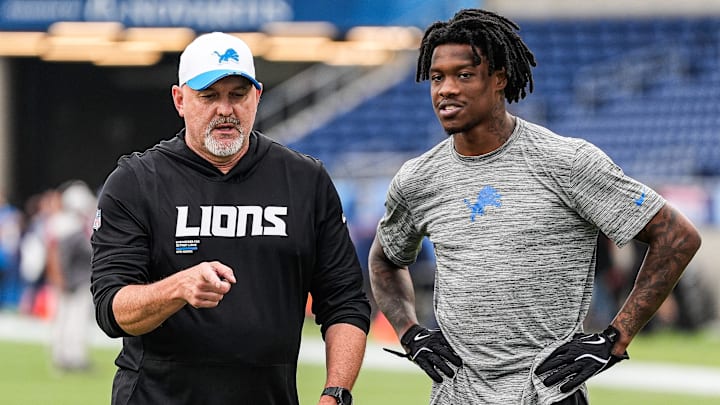 Detroit Lions offensive coordinator John Morton, left, talks to wide receiver Jameson Williams (1) at warm up ahead of the Hall of Fame Game at Tom Benson Hall of Fame Stadium in Canton, Ohio on Thursday, July 31, 2025.