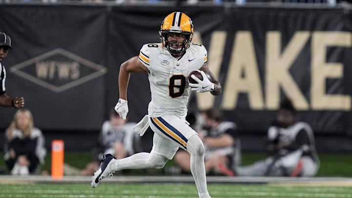 Nov 8, 2024; Winston-Salem, North Carolina, USA; California Golden Bears wide receiver Mikey Matthews (8) runs around end after a catch against the Wake Forest Demon Deacons during the first half at Allegacy Federal Credit Union Stadium. Mandatory Credit: Jim Dedmon-Imagn Images