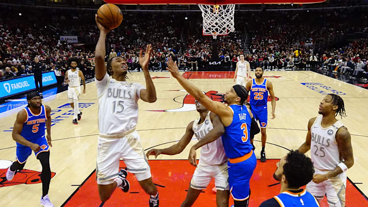 Jan 4, 2025; Chicago, Illinois, USA; Chicago Bulls forward Julian Phillips (15) shoots the ball against New York Knicks guard Josh Hart (3) during the second half at United Center. Mandatory Credit: David Banks-Imagn Images Jan 4, 2025; Chicago, Illinois, USA; Chicago Bulls forward Julian Phillips (15) shoots the ball against New York Knicks guard Josh Hart (3) during the second half at United Center. Mandatory Credit: David Banks-Imagn Images