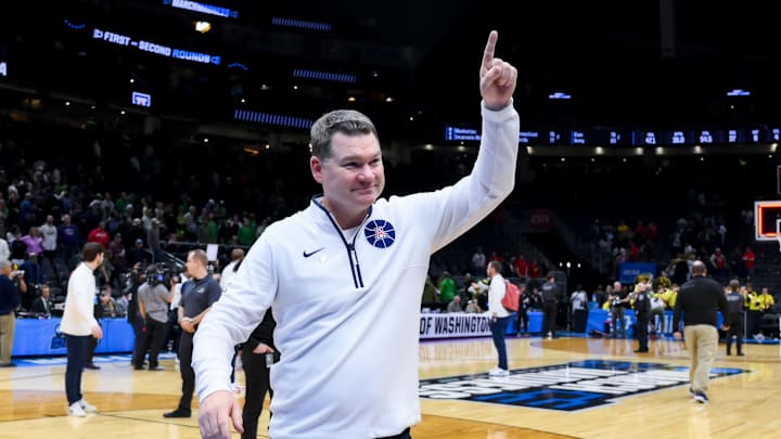 Mar 23, 2025; Seattle, WA, USA;  Arizona Wildcats head coach Tommy Lloyd celebrates after defeating the Oregon Ducks at Climate Pledge Arena. Mandatory Credit: Stephen Brashear-Imagn Images