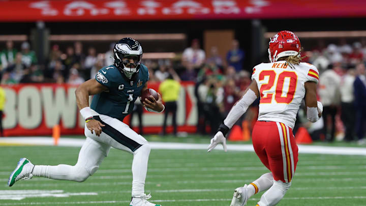 Feb 9, 2025; New Orleans, LA, USA; Philadelphia Eagles quarterback Jalen Hurts (1) runs with the ball as Kansas City Chiefs safety Justin Reid (20) chases during Super Bowl LIX at Caesars Superdome. Mandatory Credit: Geoff Burke-Imagn Images