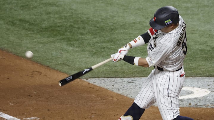Mar 21, 2023; Miami, Florida, USA; Japan third baseman Munetaka Murakami (55) hits a home run against the USA in the second inning at LoanDepot Park. Mandatory Credit: Rhona Wise-Imagn Images