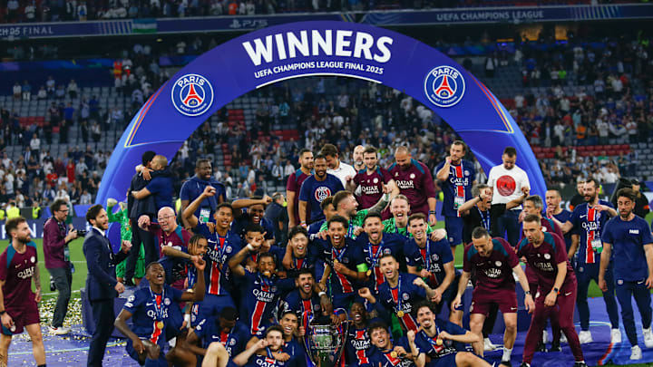 Players of Paris Saint-Germain pose for a photograph with... Players of Paris Saint-Germain pose for a photograph with...