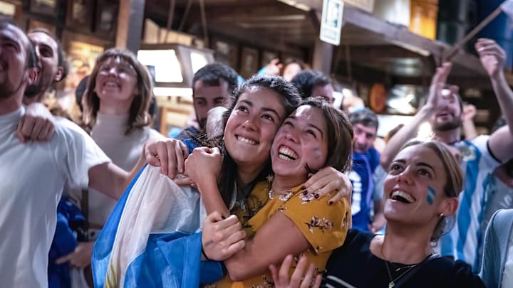 Argentinian women embrace to celebrate the national team's... Argentinian women embrace to celebrate the national team's...