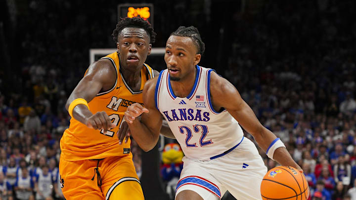 Dec 7, 2025; Kansas City, Missouri, USA; Kansas Jayhawks guard Darryn Peterson (22) drives against Missouri Tigers forward Mark Mitchell (25) during the first half at T-Mobile Center. Mandatory Credit: Jay Biggerstaff-Imagn Images Dec 7, 2025; Kansas City, Missouri, USA; Kansas Jayhawks guard Darryn Peterson (22) drives against Missouri Tigers forward Mark Mitchell (25) during the first half at T-Mobile Center. Mandatory Credit: Jay Biggerstaff-Imagn Images