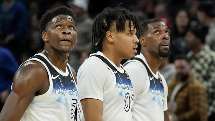 Feb 13, 2025; Minneapolis, Minnesota, USA; Minnesota Timberwolves guard Anthony Edwards (5) and guard Terrence Shannon Jr. (00) and center Naz Reid (11) walk off the court for a timeout in the first quarter of the game with the Oklahoma City Thunder at Target Center. Mandatory Credit: Bruce Kluckhohn-Imagn Images