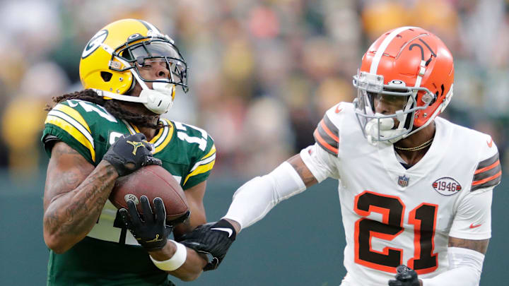 Green Bay Packers wide receiver Davante Adams (17) catches a pass against Cleveland Browns cornerback Denzel Ward on Christmas in 2021. Green Bay Packers wide receiver Davante Adams (17) catches a pass against Cleveland Browns cornerback Denzel Ward on Christmas in 2021.