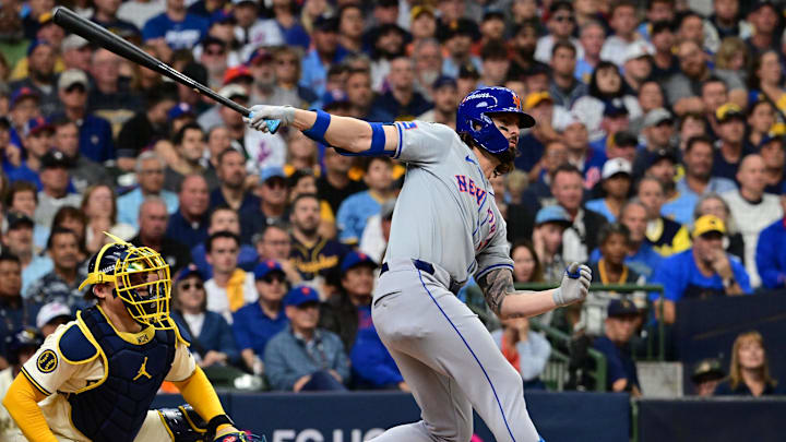 Oct 1, 2024; Milwaukee, Wisconsin, USA; New York Mets outfielder Jesse Winker (3) hits a two run triple against the Milwaukee Brewers during the second inning in game one of the Wildcard round for the 2024 MLB Playoffs at American Family Field. Mandatory Credit: Benny Sieu-Imagn Images