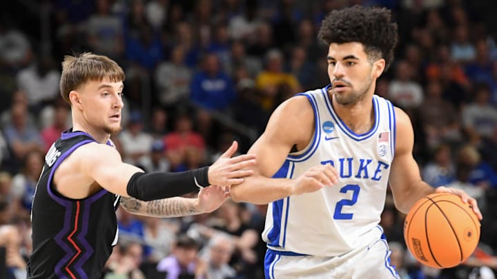 TCU Horned Frogs guard Brock Harding (2) defends Duke Blue Devils guard Cayden Boozer (2) Saturday, March 21, 2026, during the NCAA Men’s Basketball Tournament second round game at Bon Secours Wellness Arena in Greenville, South Carolina.