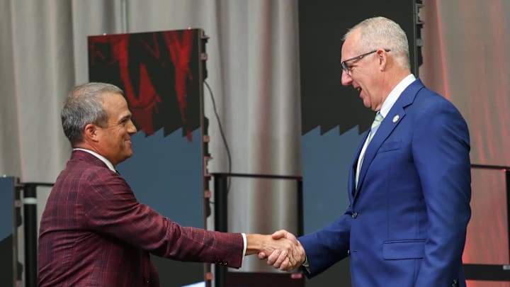 Jul 14, 2025; Atlanta, GA, USA; South Carolina Gamecocks head coach Shane Beamer and SEC commissioner Greg Sankey shake hands during SEC Media Day at Omni Atlanta Hotel. Mandatory Credit: Jordan Godfree-Imagn Images Jul 14, 2025; Atlanta, GA, USA; South Carolina Gamecocks head coach Shane Beamer and SEC commissioner Greg Sankey shake hands during SEC Media Day at Omni Atlanta Hotel. Mandatory Credit: Jordan Godfree-Imagn Images