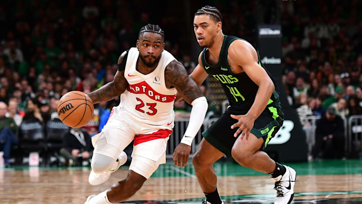 Dec 31, 2024; Boston, Massachusetts, USA; Toronto Raptors guard Jamal Shead (23) controls the ball while Boston Celtics guard Jaden Springer (44) defends during the second half at TD Garden. Mandatory Credit: Bob DeChiara-Imagn Images