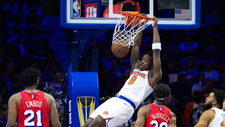 Nov 12, 2024; Philadelphia, Pennsylvania, USA; New York Knicks forward OG Anunoby (8) dunks the ball in front of Philadelphia 76ers center Joel Embiid (21) and forward Guerschon Yabusele (28) during the fourth quarter at Wells Fargo Center. Mandatory Credit: Bill Streicher-Imagn Images Nov 12, 2024; Philadelphia, Pennsylvania, USA; New York Knicks forward OG Anunoby (8) dunks the ball in front of Philadelphia 76ers center Joel Embiid (21) and forward Guerschon Yabusele (28) during the fourth quarter at Wells Fargo Center. Mandatory Credit: Bill Streicher-Imagn Images