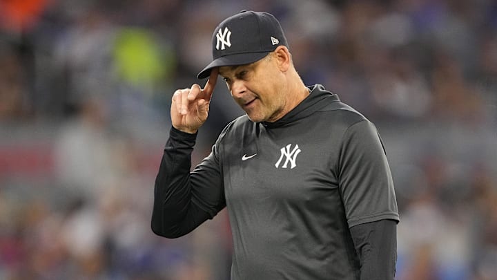 Jul 3, 2025; Toronto, Ontario, CAN; New York Yankees manager Aaron Boone walks to the dug out after making a pitching change against the Toronto Blue Jays during the fifth inning at Rogers Centre. Mandatory Credit: John E. Sokolowski-Imagn Images
