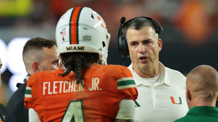 Oct 17, 2026; Miami Gardens, Florida, USA; Miami Hurricanes head coach Mario Cristobal talks to running back Mark Fletcher Jr. (4) during the fourth quarter against the Florida State Seminoles at Hard Rock Stadium. Mandatory Credit: Sam Navarro-Imagn Images Oct 17, 2026; Miami Gardens, Florida, USA; Miami Hurricanes head coach Mario Cristobal talks to running back Mark Fletcher Jr. (4) during the fourth quarter against the Florida State Seminoles at Hard Rock Stadium. Mandatory Credit: Sam Navarro-Imagn Images