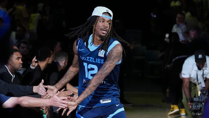 Grizzlies' Ja Morant (12) walks onto the court for open practice at the FedExForum on October 4, 2025, in Memphis, Tenn.