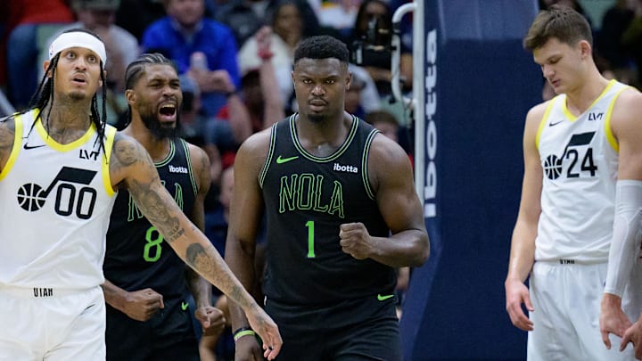 Jan 23, 2024; New Orleans, Louisiana, USA; New Orleans Pelicans forward Zion Williamson (1) celebrates a basket with forward Naji Marshall (8) next Utah Jazz guard Jordan Clarkson (00) and center Walker Kessler (24) during the second half at Smoothie King Center. Mandatory Credit: Matthew Hinton-Imagn Images