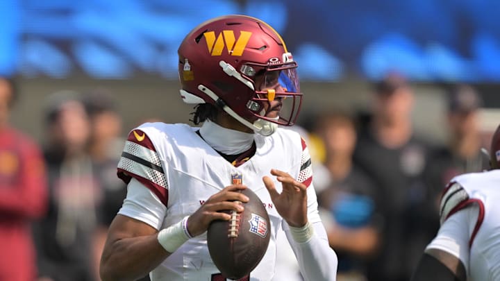 Oct 5, 2025; Inglewood, California, USA;  Washington Commanders quarterback Jayden Daniels (5) looks to throw against the Los Angeles Chargers in the first half at SoFi Stadium. Mandatory Credit: Jayne Kamin-Oncea-Imagn Images
