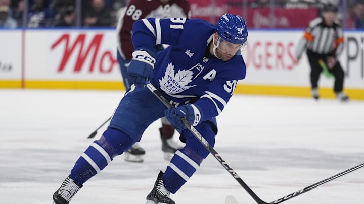 Mar 19, 2025; Toronto, Ontario, CAN; Toronto Maple Leafs forward John Tavares (91) carries the puck against the Colorado Avalanche during the third period at Scotiabank Arena. Mandatory Credit: John E. Sokolowski-Imagn Images