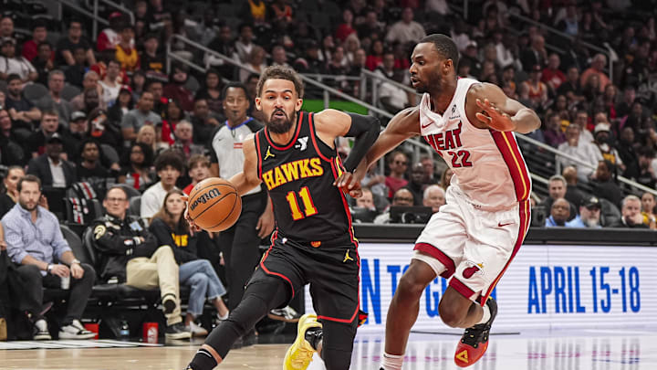 Apr 18, 2025; Atlanta, Georgia, USA; Atlanta Hawks guard Trae Young (11) tries to dribble past Miami Heat forward Andrew Wiggins (22) during the first half at State Farm Arena. Mandatory Credit: Dale Zanine-Imagn Images Apr 18, 2025; Atlanta, Georgia, USA; Atlanta Hawks guard Trae Young (11) tries to dribble past Miami Heat forward Andrew Wiggins (22) during the first half at State Farm Arena. Mandatory Credit: Dale Zanine-Imagn Images