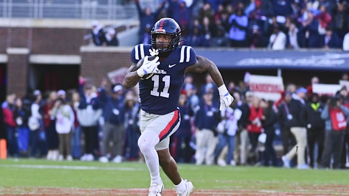 Nov 29, 2024; Oxford, Mississippi, USA;  Mississippi Rebels linebacker Chris Paul Jr. (11) runs the ball after an interception against the Mississippi State Bulldogs during the first quarter at Vaught-Hemingway Stadium. Mandatory Credit: Matt Bush-Imagn Images