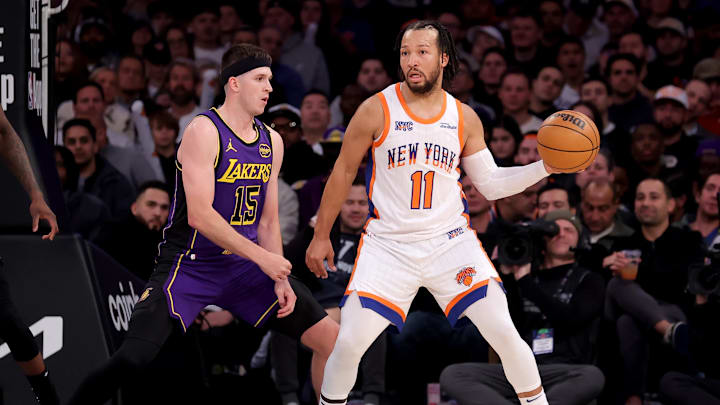 Feb 1, 2025; New York, New York, USA; New York Knicks guard Jalen Brunson (11) looks to pass the ball against Los Angeles Lakers guard Austin Reaves (15) during the third quarter at Madison Square Garden. Mandatory Credit: Brad Penner-Imagn Images Feb 1, 2025; New York, New York, USA; New York Knicks guard Jalen Brunson (11) looks to pass the ball against Los Angeles Lakers guard Austin Reaves (15) during the third quarter at Madison Square Garden. Mandatory Credit: Brad Penner-Imagn Images