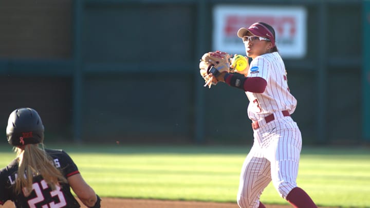 Florida State softball's Isa Torres (#3) turns a double play against Texas Tech in the NCAA Super Regionals