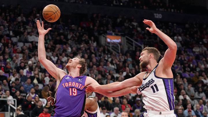 Nov 2, 2024; Toronto, Ontario, CAN; Toronto Raptors center Jakob Poeltl (19) battles with Sacramento Kings forward Domantas Sabonis (11) for a rebound during the first half at Scotiabank Arena. Mandatory Credit: John E. Sokolowski-Imagn Images Nov 2, 2024; Toronto, Ontario, CAN; Toronto Raptors center Jakob Poeltl (19) battles with Sacramento Kings forward Domantas Sabonis (11) for a rebound during the first half at Scotiabank Arena. Mandatory Credit: John E. Sokolowski-Imagn Images