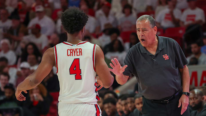 Houston coach Kelvin Sampson (right) congratulates guard LJ Cryer during a recent game.