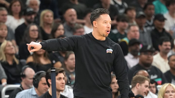 Feb 19, 2026; Austin, Texas, USA; San Antonio Spurs head coach Mitch Johnson signed  during the first half against the Phoenix Suns at Moody Center. Mandatory Credit: Scott Wachter-Imagn Images