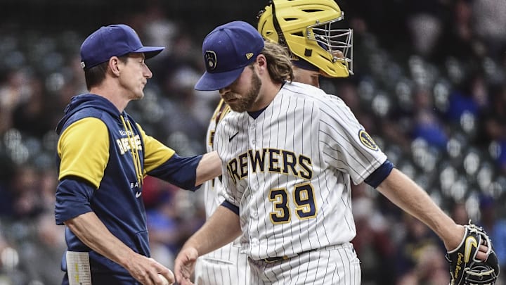 Jun 3, 2022; Milwaukee, Wisconsin, USA; Milwaukee Brewers manager Craig Counsell takes the ball from