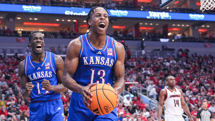 Kansas Jayhawks guard Elmarko Jackson (13) and Kansas Jayhawks guard Melvin Council Jr. (14) react in the second half during the Jayhawks' 90-82 win over the Louisville Cardinals in an exhibition basketball game at the KFC Yum! Center in Louisville, Kentucky Friday, October 24, 2025.