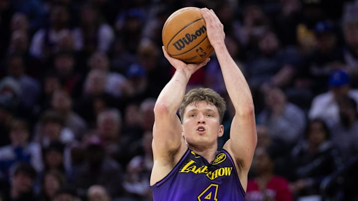 Jan 28, 2025; Philadelphia, Pennsylvania, USA; Los Angeles Lakers guard Dalton Knecht (4) shoots against the Philadelphia 76ers during the second quarter at Wells Fargo Center. Mandatory Credit: Bill Streicher-Imagn Images
