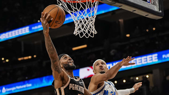 Mar 16, 2026; Atlanta, Georgia, USA; Atlanta Hawks guard Nickeil Alexander-Walker (7) scores behind Orlando Magic guard Jalen Suggs (4) during the second half at State Farm Arena. Mandatory Credit: Dale Zanine-Imagn Images Mar 16, 2026; Atlanta, Georgia, USA; Atlanta Hawks guard Nickeil Alexander-Walker (7) scores behind Orlando Magic guard Jalen Suggs (4) during the second half at State Farm Arena. Mandatory Credit: Dale Zanine-Imagn Images