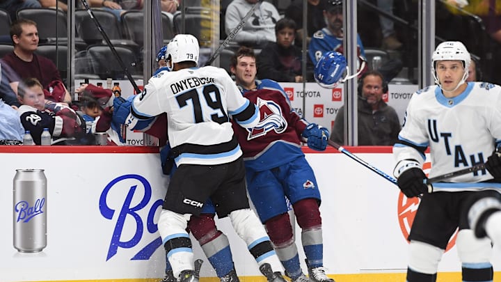 Sep 29, 2024; Denver, Colorado, USA; Colorado Avalanche right wing Jason Polin (41) is hit by Utah Hockey Club defenseman Montana Onyebucki (79) during the second period at Ball Arena. Mandatory Credit: Christopher Hanewinckel-Imagn Images