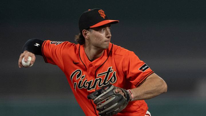 San Francisco, California, USA;  San Francisco Giants third baseman Shay Whitcomb (13) looks to throw during the fifth inning against the Los Angeles Dodgers at Oracle Park.  Mandatory Credit: Stan Szeto-Imagn Images
