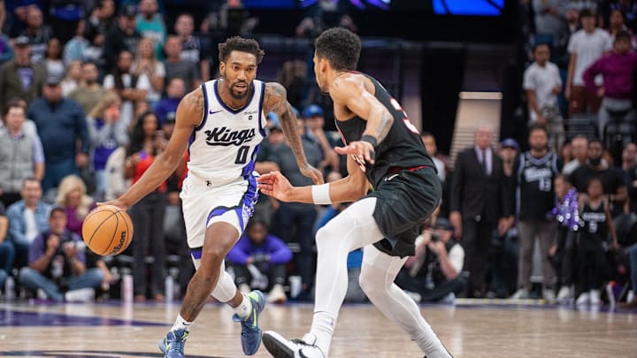 Nov 8, 2023; Sacramento, California, USA; Sacramento Kings guard Malik Monk (0) pushes the ball up