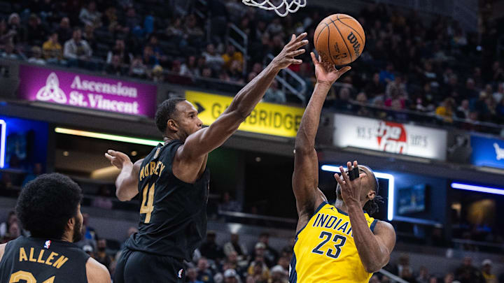 Jan 6, 2026; Indianapolis, Indiana, USA;  Indiana Pacers guard/forward Aaron Nesmith (23) shoots the ball while  Cleveland Cavaliers center Evan Mobley (4) defends in the second half at Gainbridge Fieldhouse. Mandatory Credit: Trevor Ruszkowski-Imagn Images