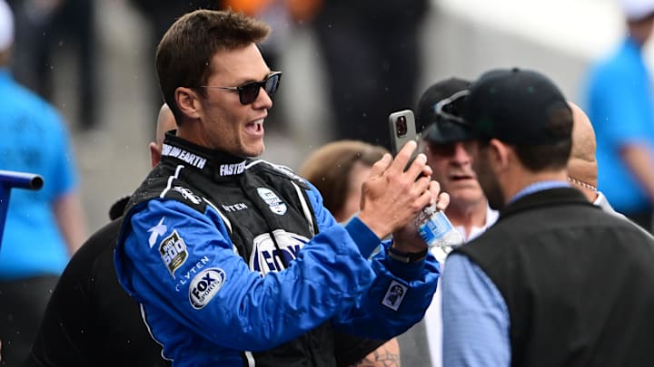 May 25, 2025; Indianapolis, Indiana, USA; Tom Brady looks on before the 109th Running of the Indianapolis 500 at Indianapolis Motor Speedway. Mandatory Credit: Marc Lebryk-Imagn Images