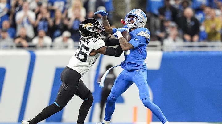 Nov 17, 2024; Detroit, MI, USA; Detroit Lions wide receiver Jameson Williams (9) is pushed out of bound by Jacksonville Jaguars safety Antonio Johnson (26) during the first half at Ford Field in Detroit on Sunday, Nov. 17, 2024. Mandatory Credit: Junfu Han/USA TODAY Network via Imagn Images 